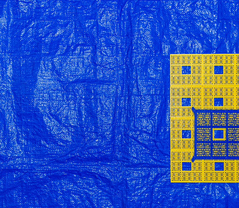 Pictured are multiple bright yellow 3D printed tiles as well as a dark blue larger tile, put together in a grid formation on the left area of the composition. These 3D printed objects are laid on top of a large, wrinkled, and slightly reflective blue tarp that is used as a backdrop. Everything is seen at bird's eye view.